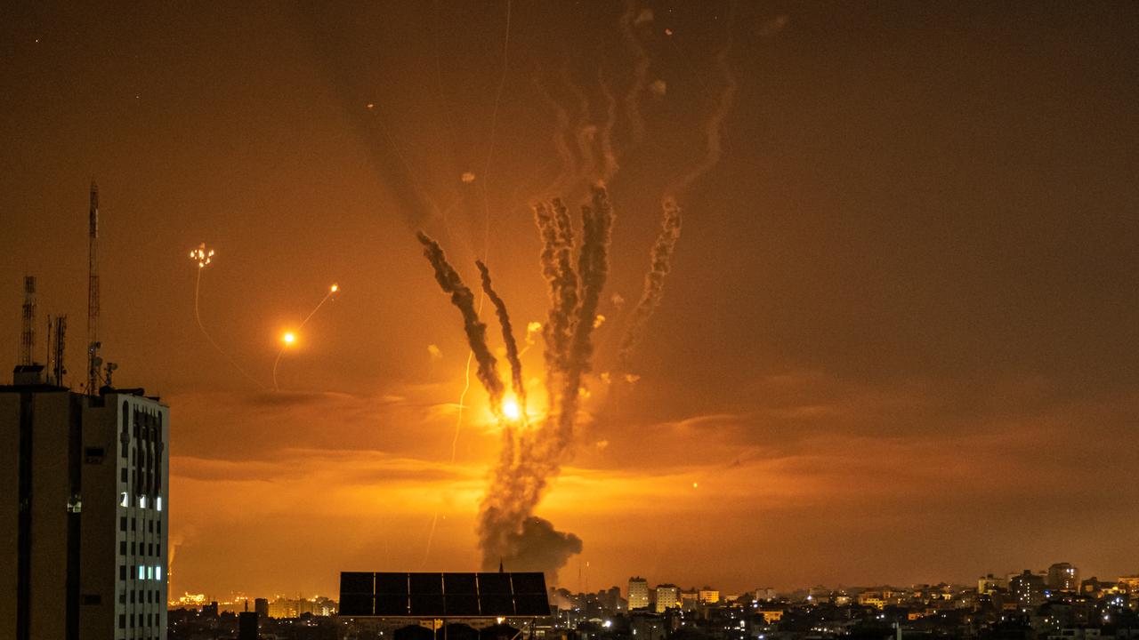 Rockets launched towards Israel from the northern Gaza Strip and response from the Israeli missile defence system known as the Iron Dome leave streaks through the sky on May 13, 2021 in Gaza City, Gaza. Picture: Fatima Shbair/Getty Images