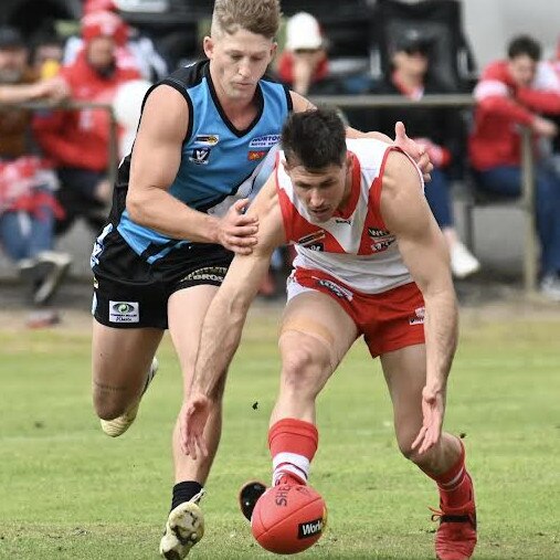 Southern Mallee Thunder's Liam Nelson chases Ararat’s Ben Taylor in the Wimmera league grand final. Picture: Georgia Hallam