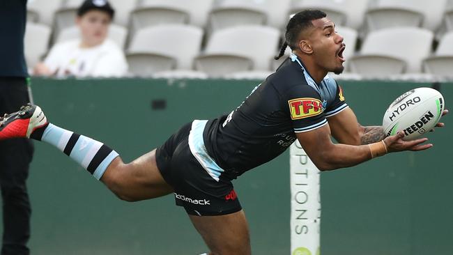 SYDNEY, AUSTRALIA - AUGUST 15: Sione Katoa of the Sharks scores a try during the round 14 NRL match between the Cronulla Sharks and the Gold Coast Titans at Netstrata Jubilee Stadium on August 15, 2020 in Sydney, Australia. (Photo by Mark Kolbe/Getty Images)