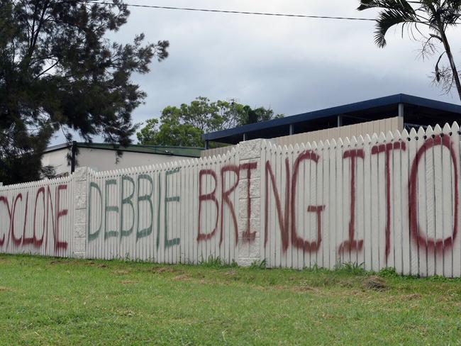 Graham Wilson painted this storm on his fence on Monday in Bowen. Picture: AAP Image/Sarah Motherwell