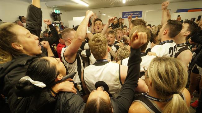 Narre Warren footballers and netballers celebrate premiership glory in the rooms on Saturday. Picture: Valeriu Campan