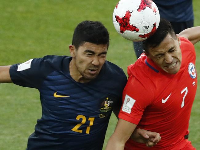 Australia's Massimo Corey Luongo, left, jumps for a header with Chile's Alexis Alejandro Sanchez during the Confederations Cup, Group B soccer match between Chile and Australia, at the Spartak Stadium in Moscow, Sunday, June 25, 2017. (AP Photo/Alexander Zemlianichenko)