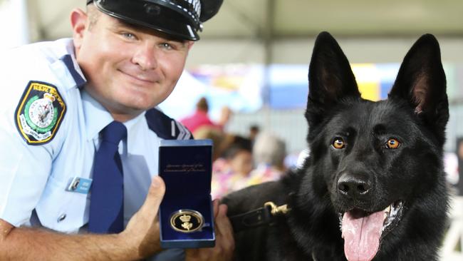 Senior Constable David Wynne with Police dog ÔUlrichÕ at the Royal Easter Show today after being awarded the inaugural 2016 Royal Agricultural Society Canine Hero Award. Picture: Justin Lloyd