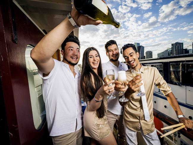 Richard, Madeliene, Chris, and James, enjoy a drink on-board the Lady Cutler. Picture- Nicole Cleary