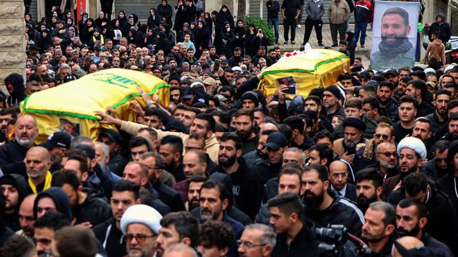 The coffins of Ali and Ibrahim Bazzi are carried through Bint Jbeil on Thursday. Picture: AFP