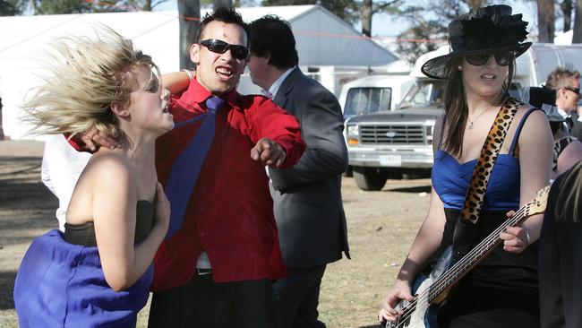 Plum Cherry bass guitarist Lucia Vanparreren keeps the beat while race goers dance