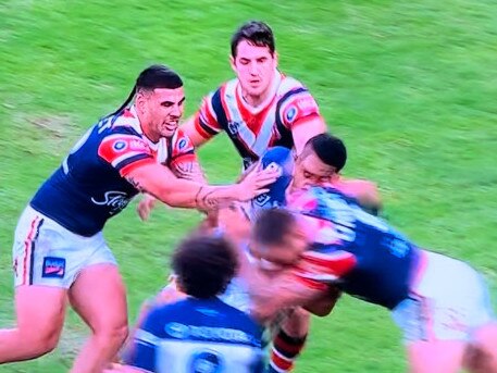 JWH makes heavy contact with the head of Cowboys forward Thomas Mikaele.