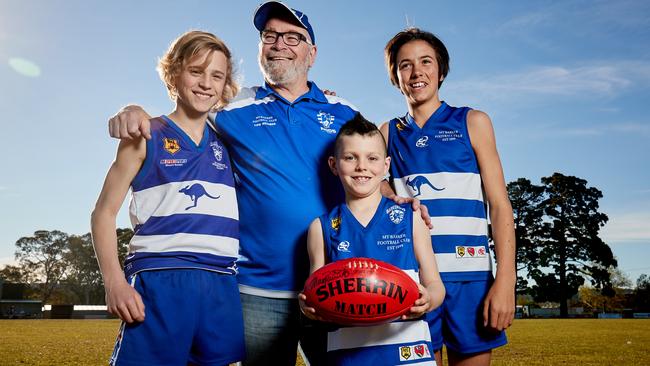 Mount Barker Football Club members Paddy, 14, president Graham Hughes, George, 13, and Jesse, 8, are looking forward to a new $38 million sports hub being built. Picture: MATT LOXTON