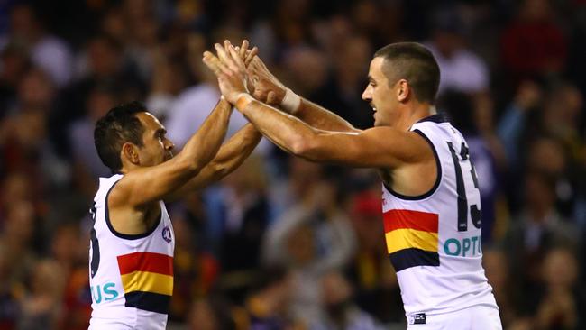 Adelaide’s Eddie Betts celebrates a goal with skipper against North Melbourne at Marvel Stadium. Picture: Photo by Scott Barbour/Getty Images.