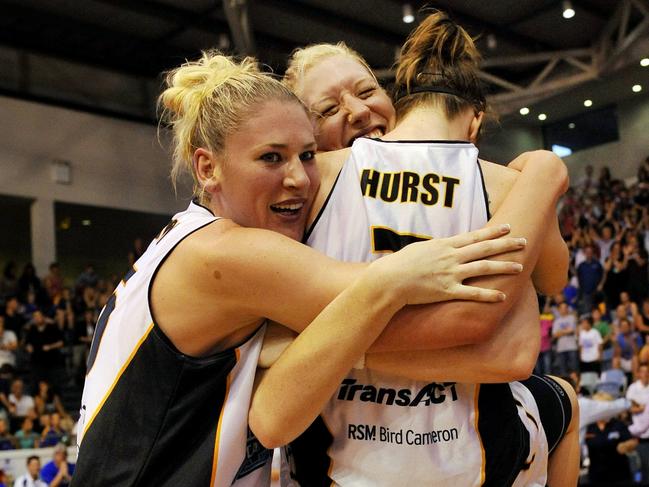 Lauren Jackson, Abby Bishop and Nat Hurst celebrate the 2010 WNBL title win.