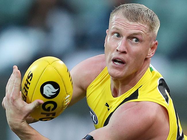 AFL - Saturday, 8th August, 2020 - Port Adelaide v Richmond at the Adelaide Oval. RichmondÃs Josh Caddy bandpasses over Xavier Duursma Picture: Sarah Reed