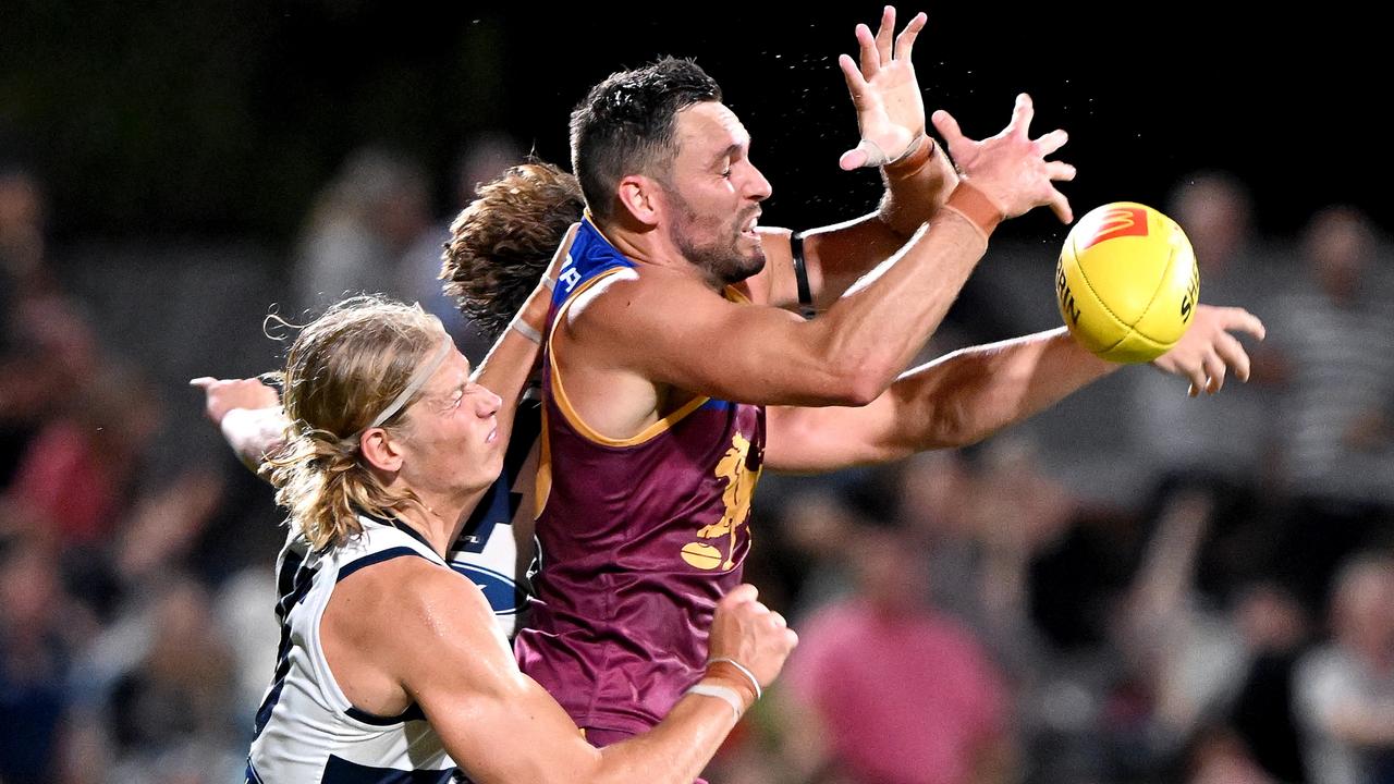 Sam De Koning and Jack Gunston compete for the ball on Thursday night. Picture: Bradley Kanaris/Getty Images