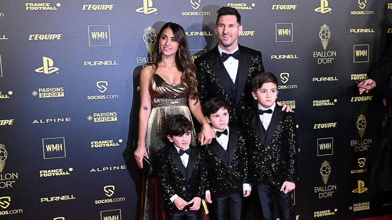 Paris Saint-Germain's Lionel Messi, his wife Antonela Roccuzzo, and their children Ciro, Mateo and Thiago pose upon arrival to attend the 2021 Ballon d'Or awards. Photo by Anne-Christine POUJOULAT / AFP.