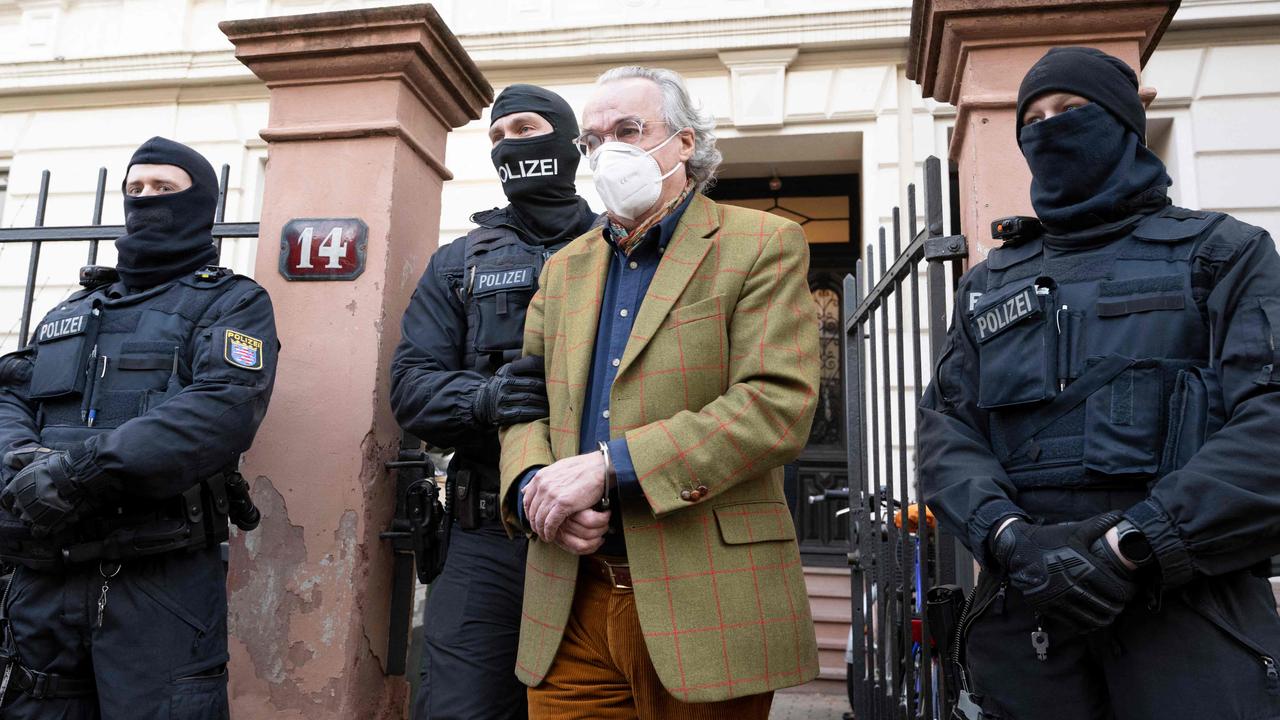 German special police forces detain Heinrich XIII Prinz Reuss after searching a house in western Germany during raids against members of a far-right "terror group" suspected of planning an attack on parliament. Picture: Boris Roessler/dpa /AFP