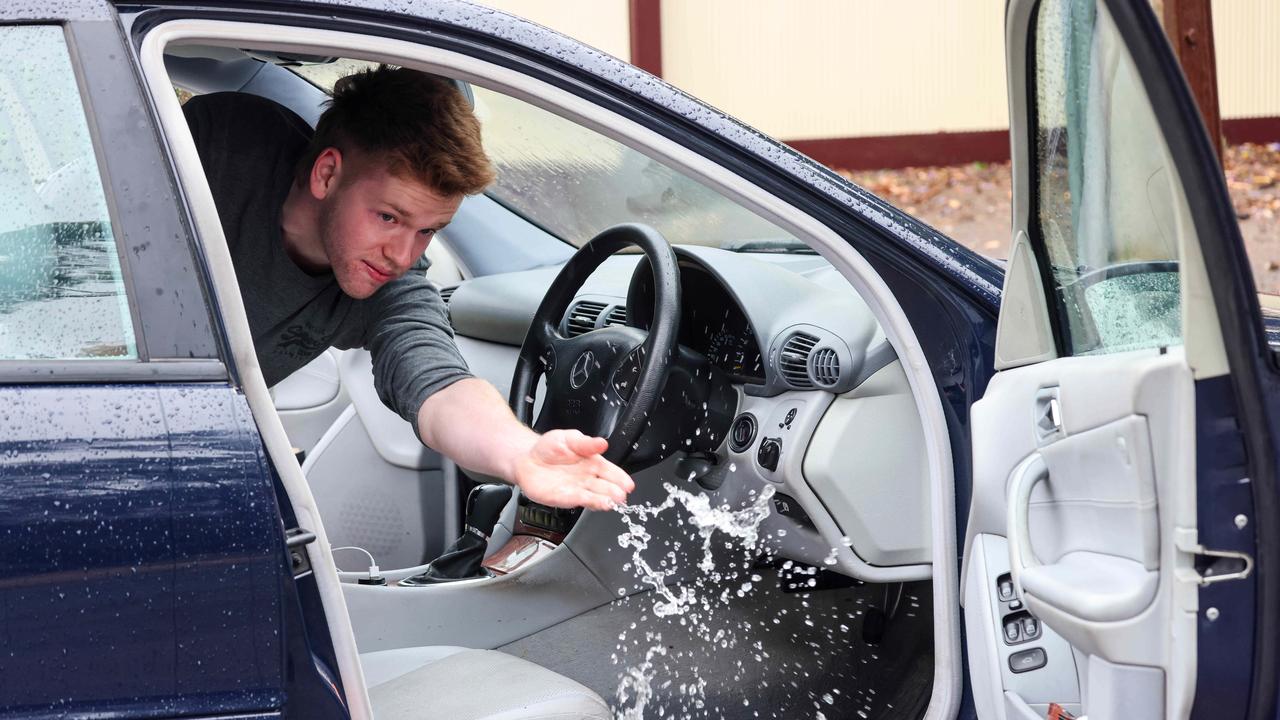 James Rawlings emptying water from his vehicle. Picture: Russell Millard Photography