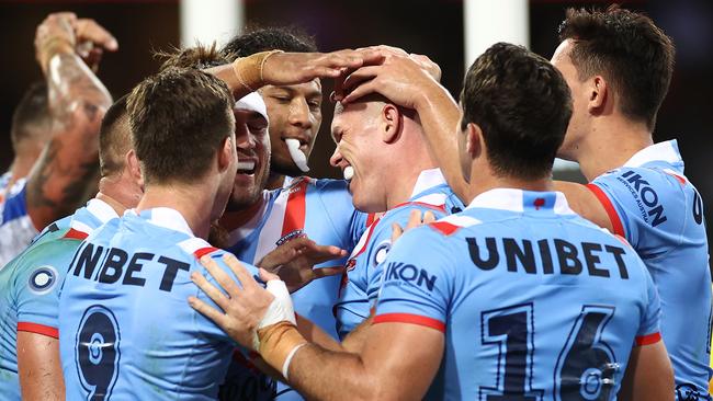 Lindsay Collins of the Roosters celebrates a try (Photo by Cameron Spencer/Getty Images)