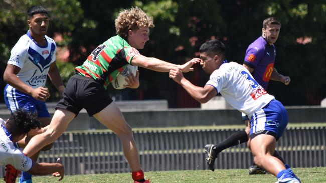 Charlie Poynton looks to shake a tackle. Picture: Sean Teuma/NewsLocal