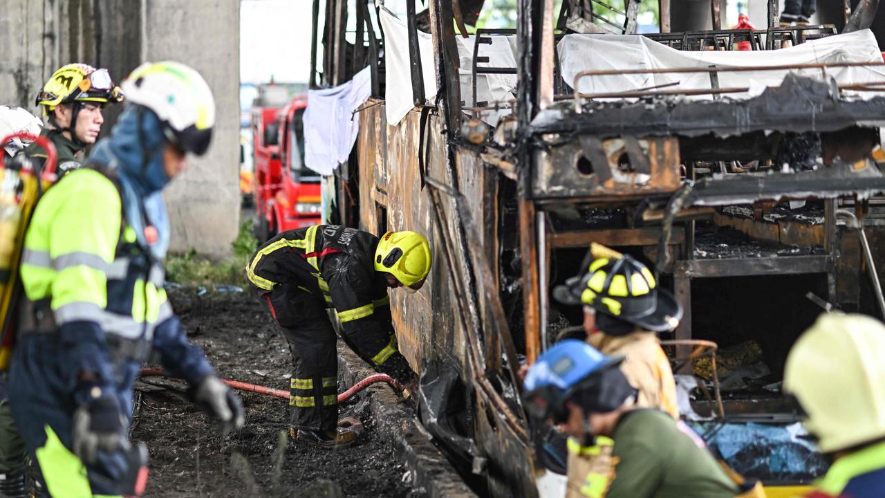 A fire engulfed a Thai school bus carrying 44 students and teachers, with up to 25 feared dead. (Photo by Manan VATSYAYANA / AFP)