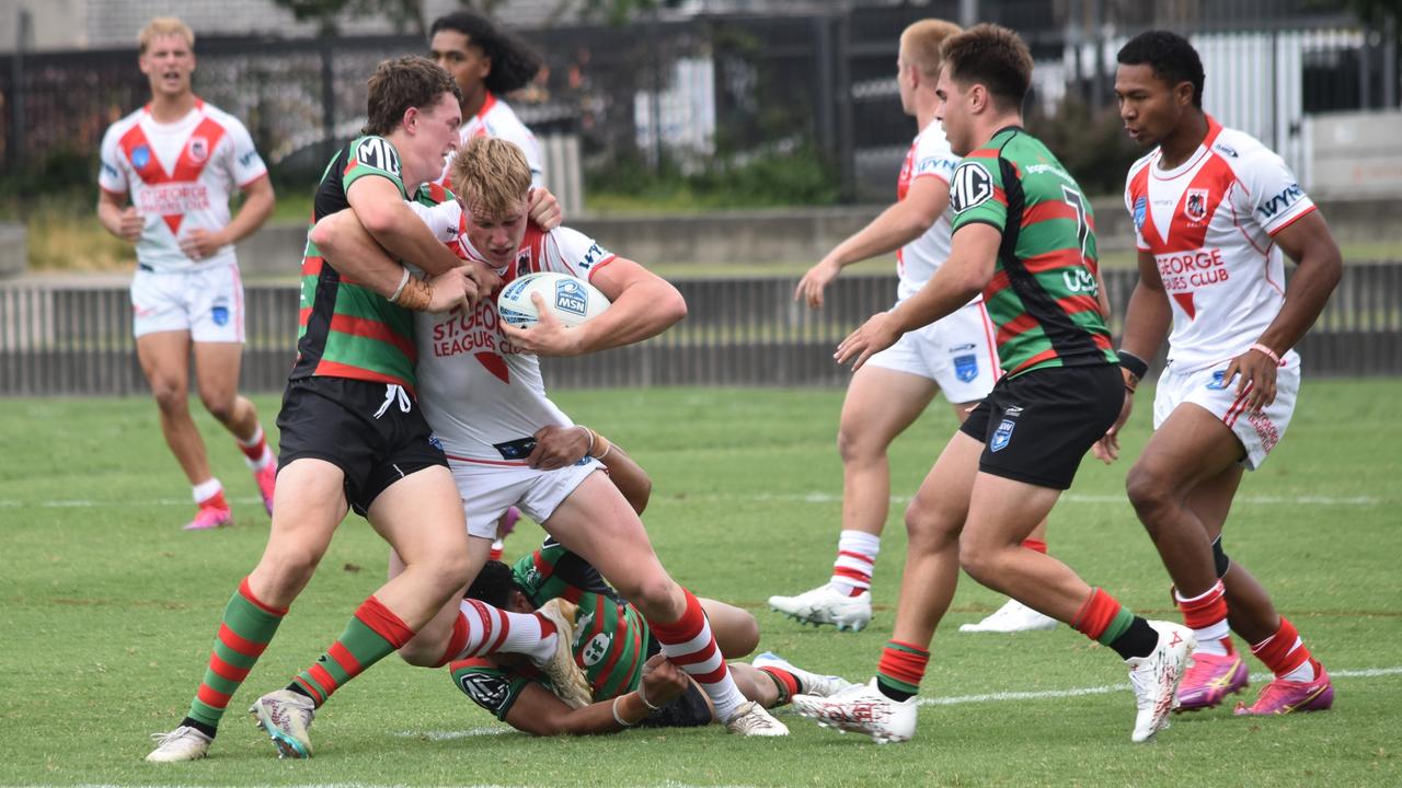 Cooper Hale is tackled by Harrison Rooke. Picture: Sean Teuma