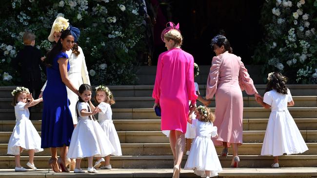 Princess Charlotte (L) with Catherine, Duchess of Cambridge (2L) and Meghan Markle's friend, Canadian fashion stylist Jessica Mulroney (2L)and other bridesmaids. Picture: AFP.