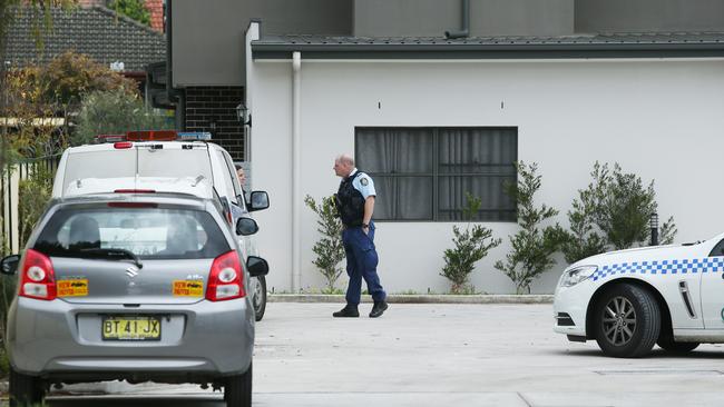 The mother of the woman burst into tears as she arrived at a townhouse, which became a crime scene. Picture: Richard Dobson