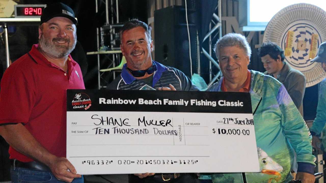 GRAND WINNER: Nathan Kropp (general manager, Toyota) and Rick Modin with Rainbow Beach Family Fishing Classic $10,000 prize winner Shane Muller. Picture: Contributed