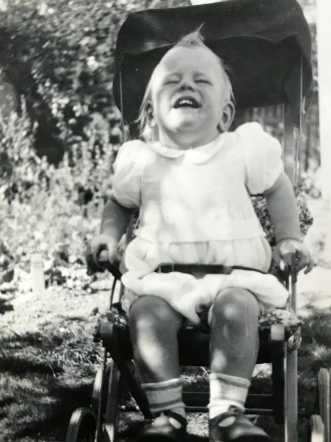 Photo of a small child in a pram - one of the family images found by Tanya Green in an old suitcase at an auction.