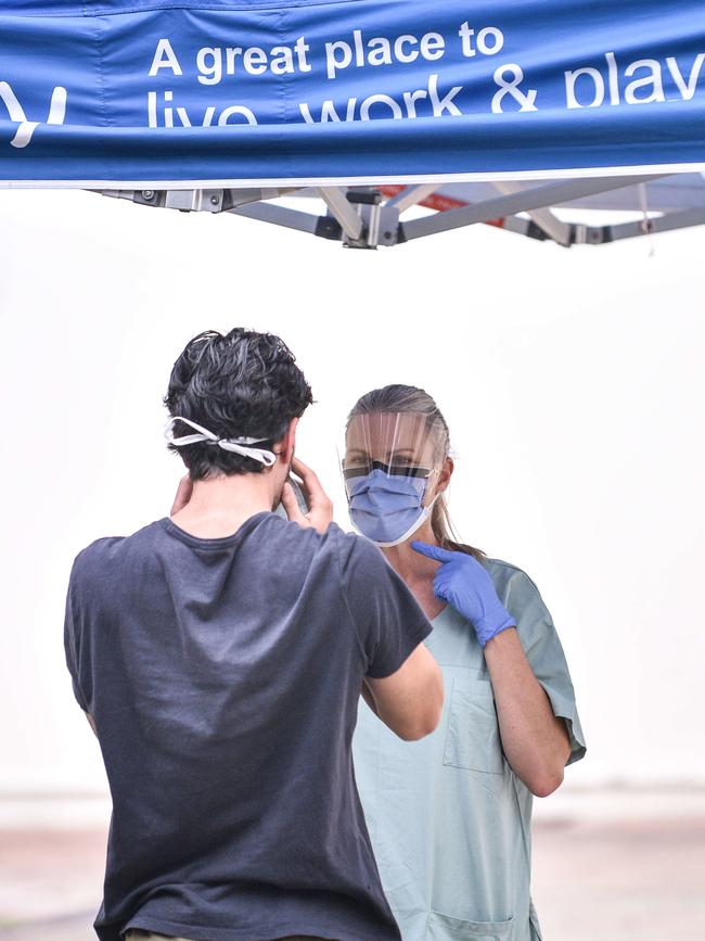 Health workers operating coronavirus tests. Picture: Flavio Brancaleone