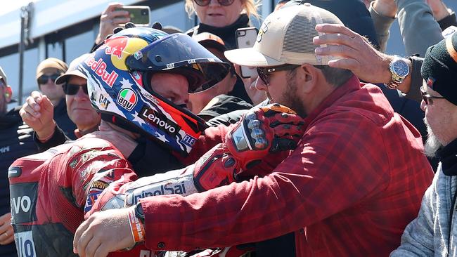 Jack Miller meets his family members after crashing out of the Australian MotoGP.