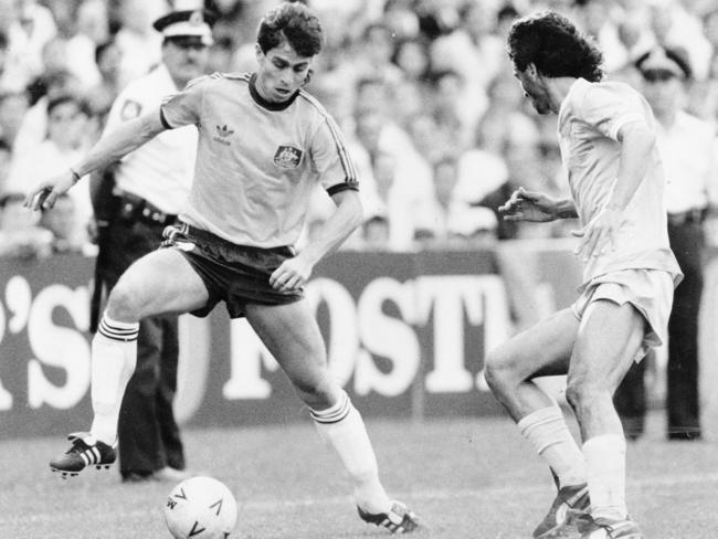 Socceroos striker Frank Farina (left) takes on an Israeli opponent during a World Cup qualifier game at the Sydney Football Stadium in 1989. Picture: Anthony Weate