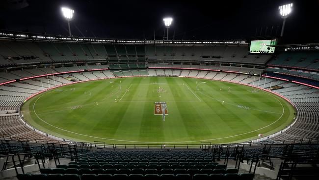 The first bounce of the 2020 AFL season is seen with an empty stadium at the MCG. The league yesterday announced the season’s suspension. Picture: Michael Willson