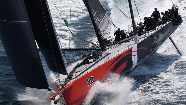 Comanche takes the lead over Info Track as the field makes its way down the coast following the start of the Sydney to Hobart Yacht race in Sydney, Thursday, December 26, 2019. (AAP Image/Dean Lewins) NO ARCHIVING, EDITORIAL USE ONLY