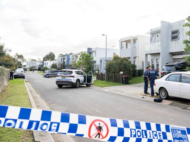Police and forensic units at the scene where a child has died after being struck by a car at Villawood on Saturday. Picture: NewsWire / Monique Harmer
