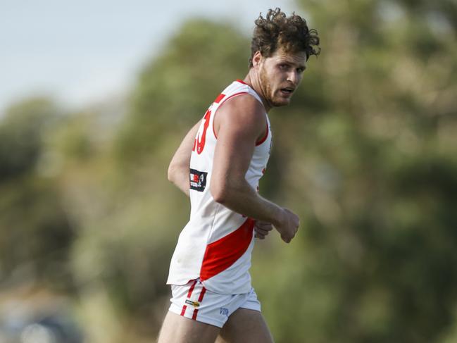 Sorrento ruckman Luke Lowden returned from a heavy hit to kick three goals in the last quarter against Mt Eliza on Saturday. Picture: Valeriu Campan