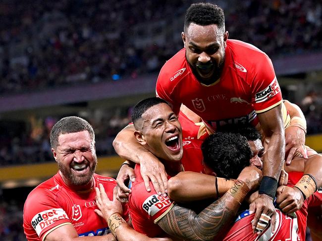 BRISBANE, AUSTRALIA - MAY 06: Valynce Te Whare of the Dolphins celebrates with his team mates after scoring a try during the round 10 NRL match between Cronulla Sharks and Dolphins at Suncorp Stadium on May 06, 2023 in Brisbane, Australia. (Photo by Bradley Kanaris/Getty Images)