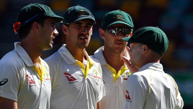 Australia’s pace trio of (l-r) Patrick Cummins, Mitchell Starc and Josh Hazlewood with Peter Handscomb at the Gabba on Sunday.