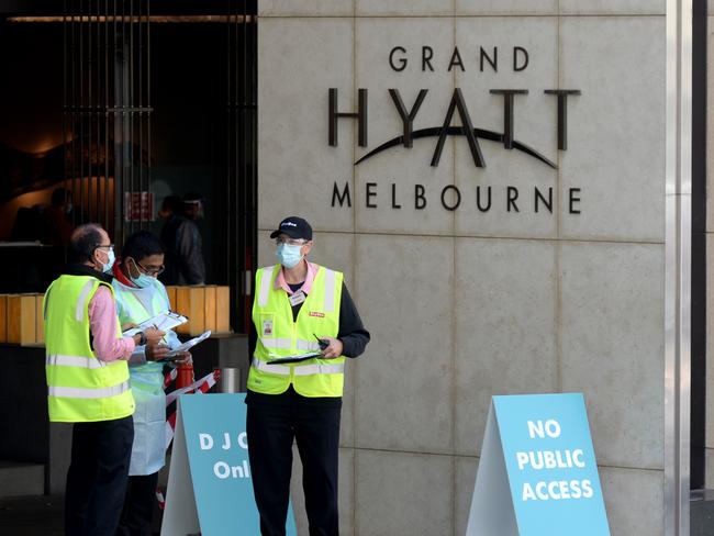 MELBOURNE, AUSTRALIA - NewsWire Photos JANUARY 19, 2021: Health and logistics staff outside the Grand Hyatt on Collins Street. It is one of three quarantine hotels for tennis players competing in the upcoming Australian Open. Picture: NCA NewsWire / Andrew Henshaw