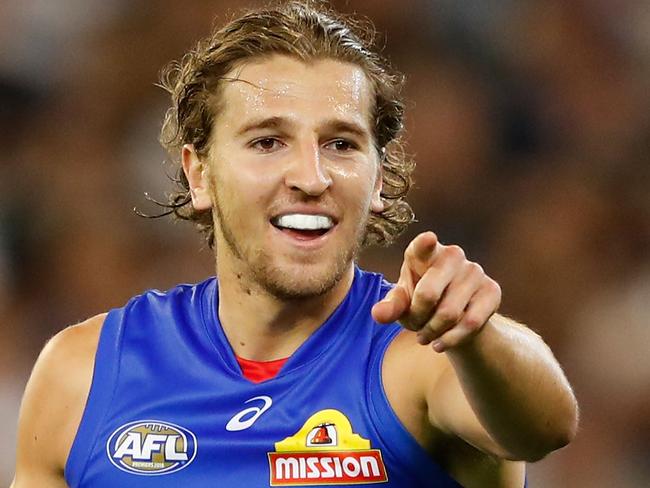 MELBOURNE, AUSTRALIA - MARCH 24: Marcus Bontempelli of the Bulldogs celebrates a goal during the 2017 AFL round 01 match between the Collingwood Magpies and the Western Bulldogs at the Melbourne Cricket Ground on March 24, 2017 in Melbourne, Australia. (Photo by Adam Trafford/AFL Media/Getty Images)