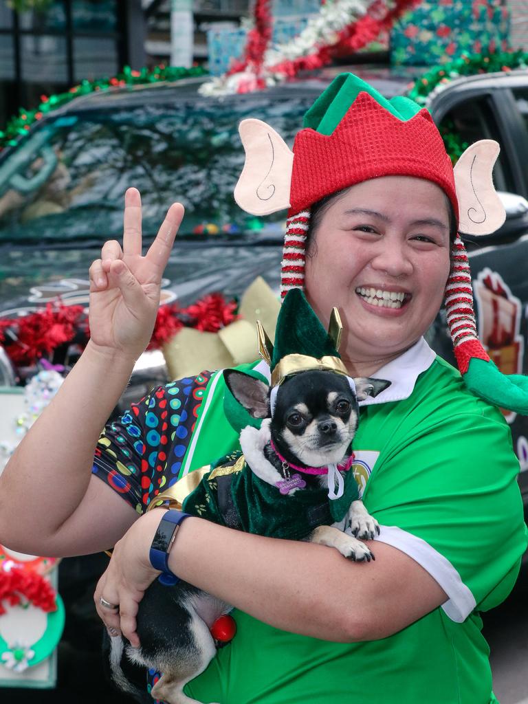 Christina Magbojos and Duchess in the annual Christmas Pageant and Parade down the Esplanade and Knuckey Streets. Picture: Glenn Campbell