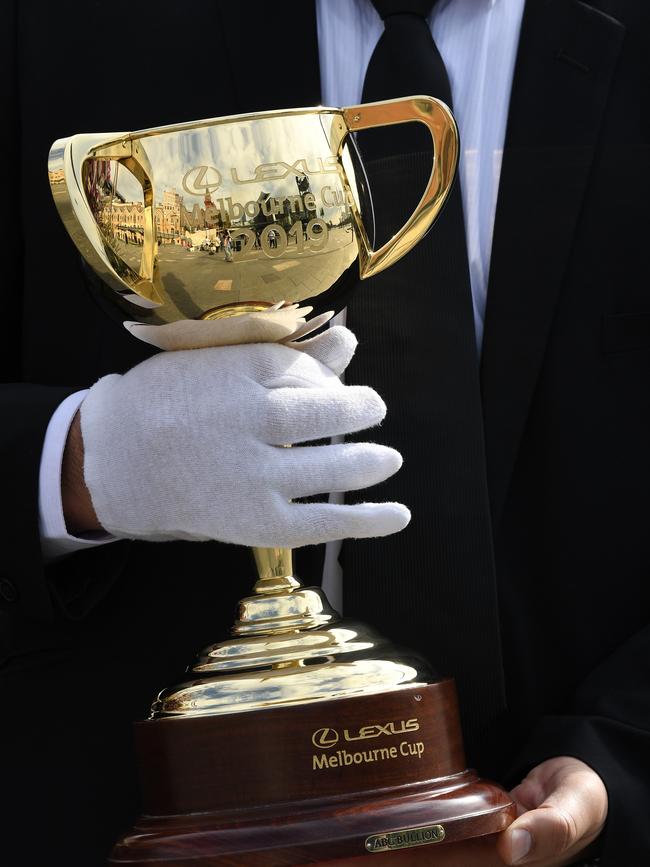 A security guard protects the Melbourne Cup on tour. Picture: AAP