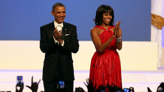President Barack Obama and first lady Michelle Obama thank their supporters at an inaugural ball. Picture: Getty