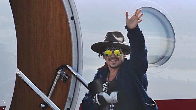 Johnny Depp leaves Brisbane Airport earlier this month for treatment to a hand injury. He is also understood to be Picture: Annette Dew