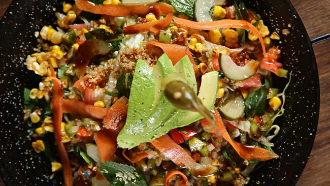 Peruvian ensalada with quinoa, pickled vegetables and chimmi churri salsa.