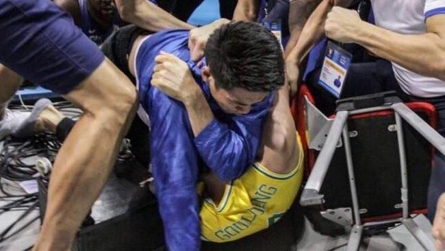 Twitter photo from Jamie Cauchi of Chris Goulding during a fight with the Filipino basketball team. "To be fair, Chris Goulding did headbutt the fists of at least four players and officials while lying on the ground."