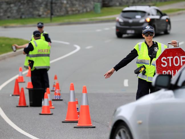 Coomera Police which are part of the Northern Patrols Group,  direct traffic to stop and pull over for a Random Breath Test on Rose Valley Drive Upper Coomera.                              Photo Scott Powick Newscorp