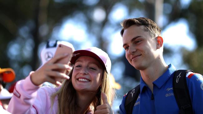 Oscar Piastri poses for a photo with a fan. Picture: Getty