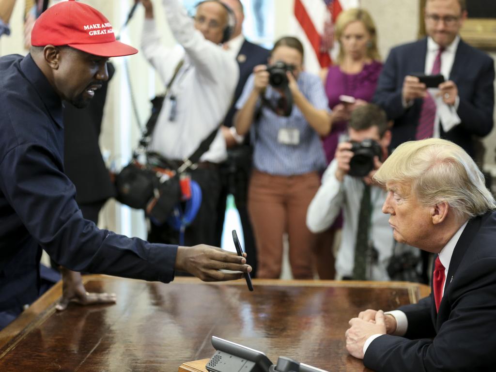 Whatever’s on Kanye West’s phone, Donald Trump’s not into it. Picture: Getty Images