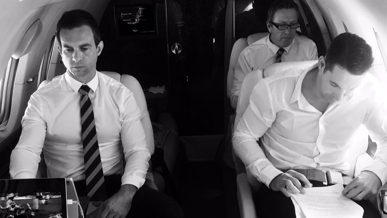 Billy Slater (right) studies his judiciary notes on the private jet ahead of the hearing on Tuesday night.