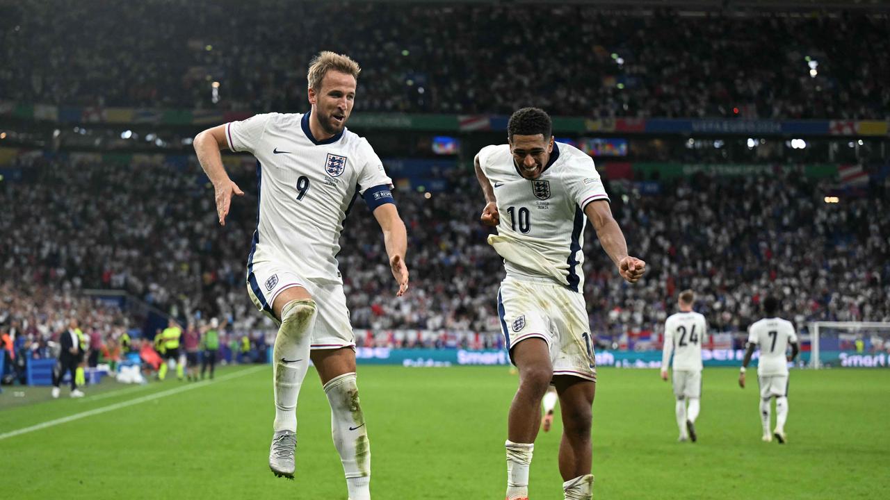 England's forward #09 Harry Kane and England's midfielder #10 Jude Bellingham celebrate after Kane scored his team's second goal. (Photo by PATRICIA DE MELO MOREIRA / AFP)