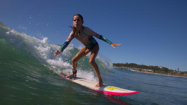 Mia Baker at her local beach. Don't take this away from us. Be smart with social distancing in the surf.